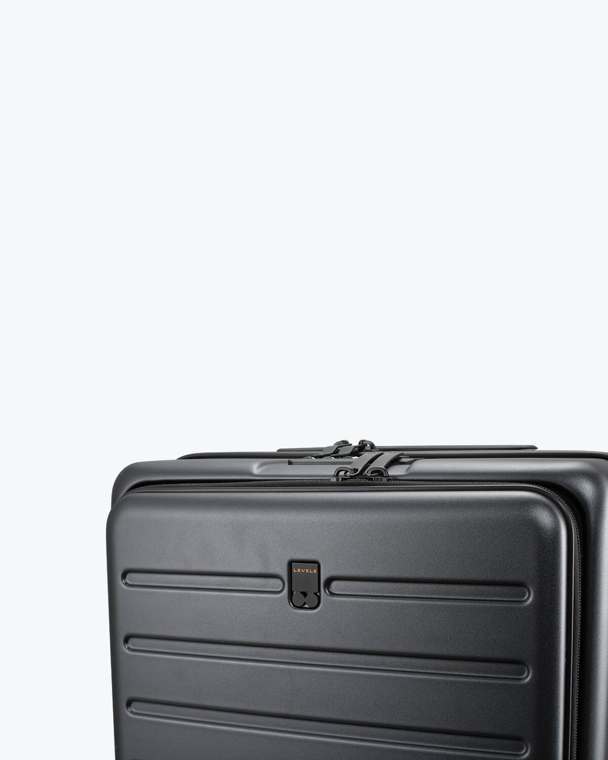 Close-up of the Road Runner Carry-On 20" gray suitcase showing the handle and zipper detail