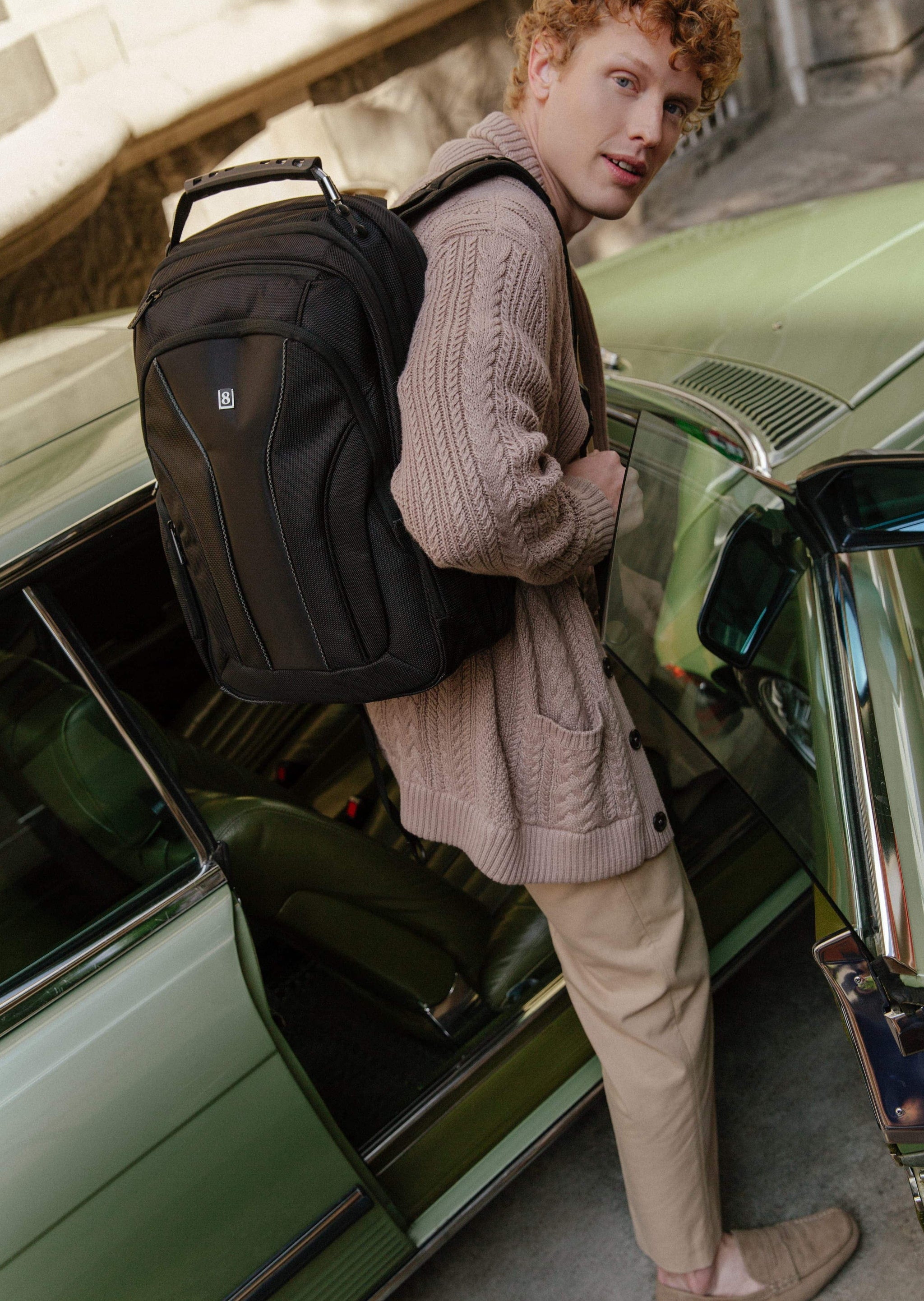 A man carrying the LEVEL8 Atlas laptop backpack